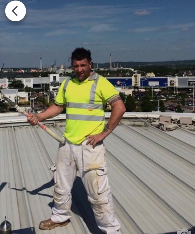 David Cooley, owner of D C Decorators, on a commercial roof job